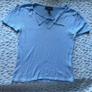 Doll pastel blue top with a bow